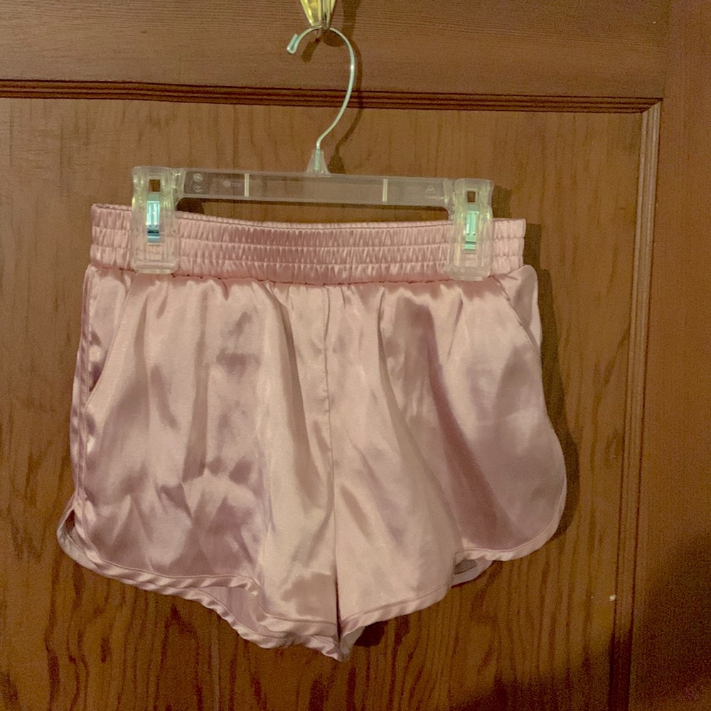 Pink satin shorts. Size 4 US and black cotton shorts size small